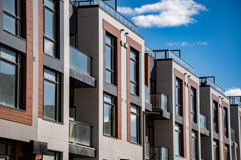 Exterior view of modern apartment building offering luxury units.